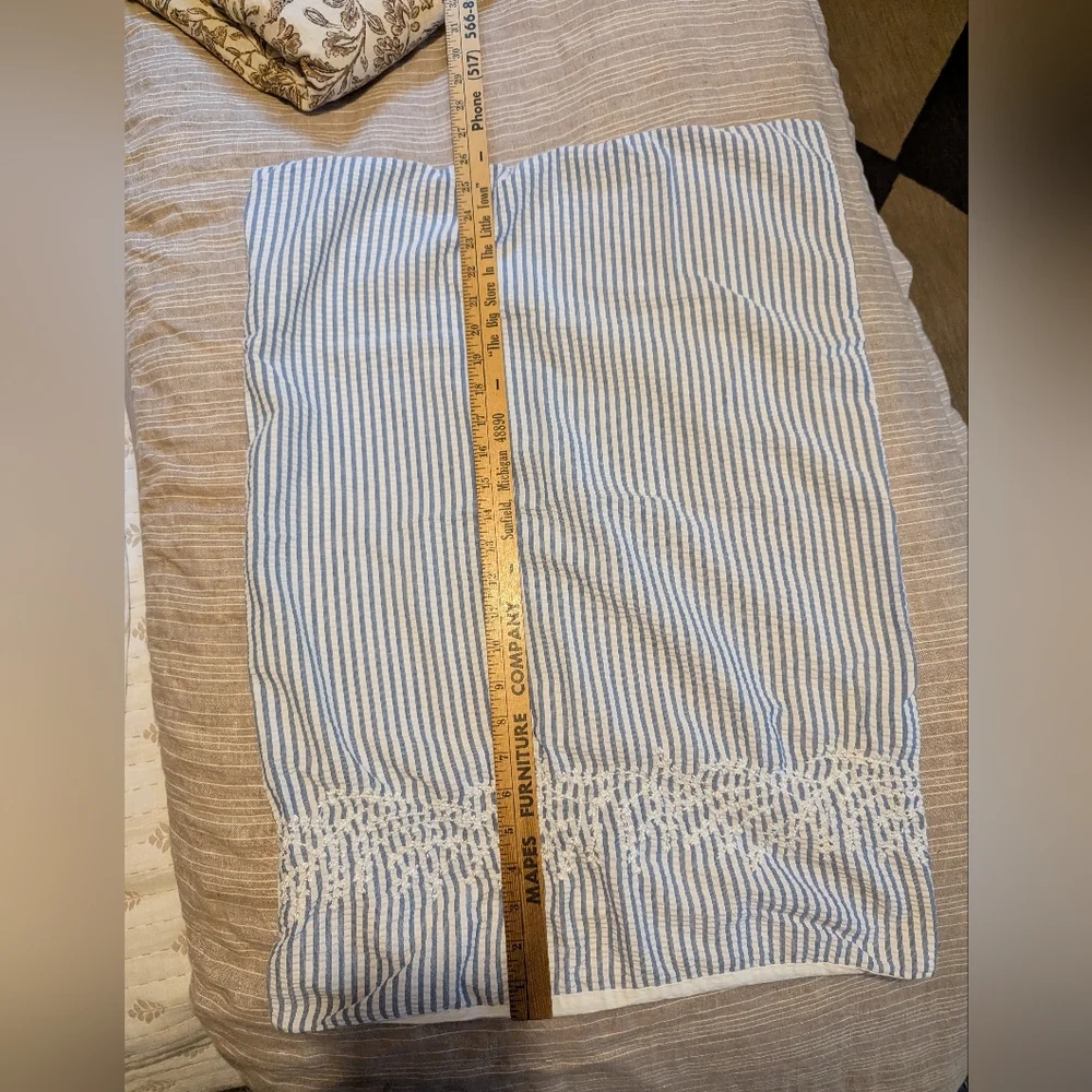 Pair of Nicole Miller embroidered seersucker cotton stripe shams